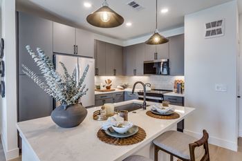 Gourmet prep islands with pendant lighting*